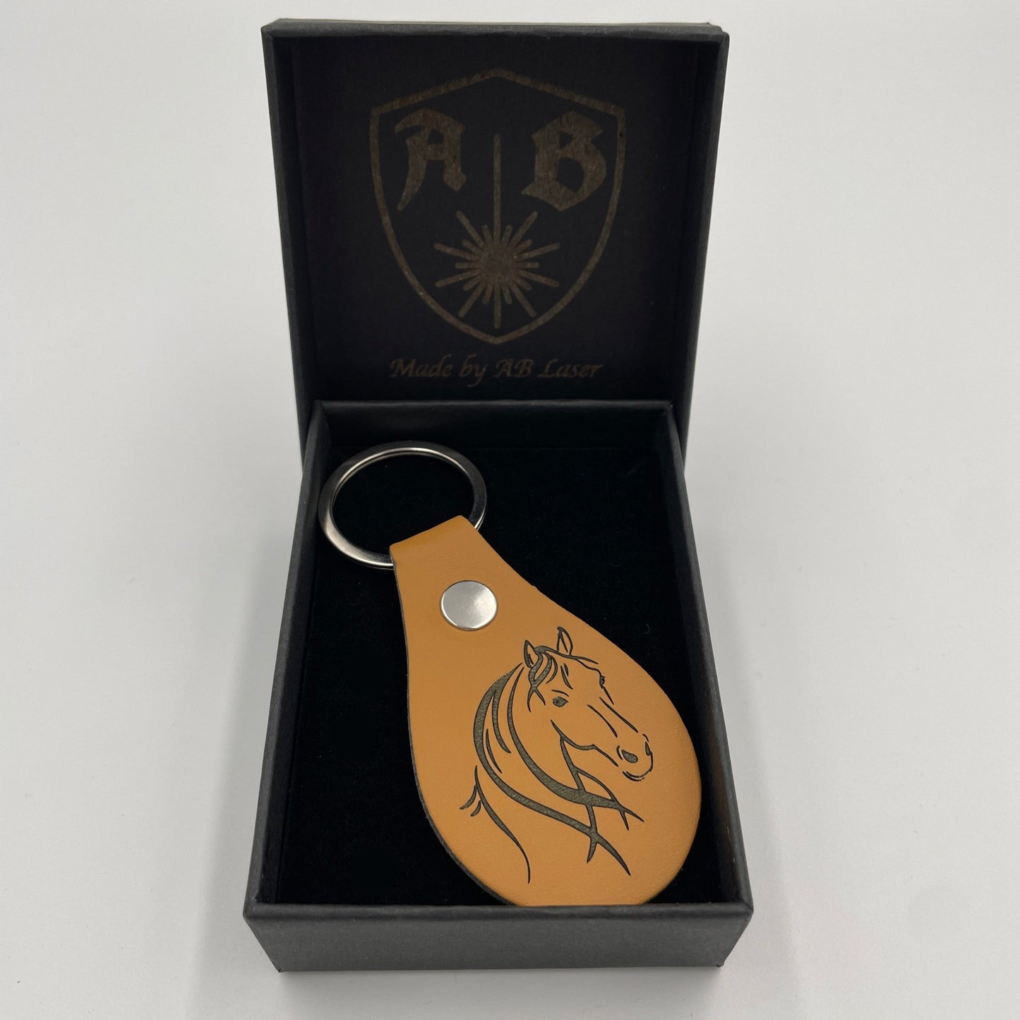Stylischer Schlüsselanhänger mit Motiv Pferd aus hochwertigem Kunstleder